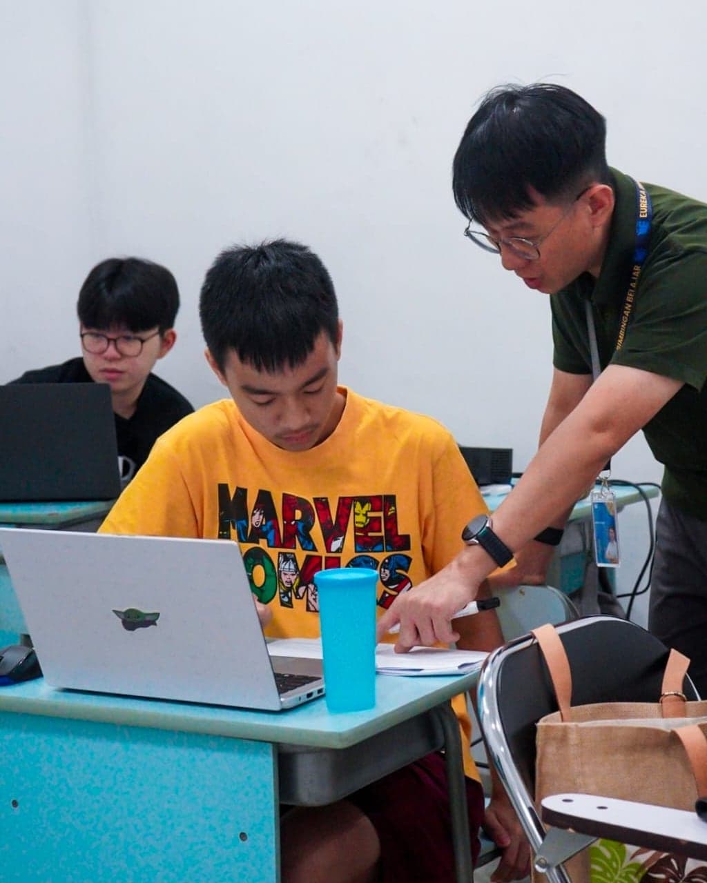 A Eureka tutor helping a student work through a problem in class